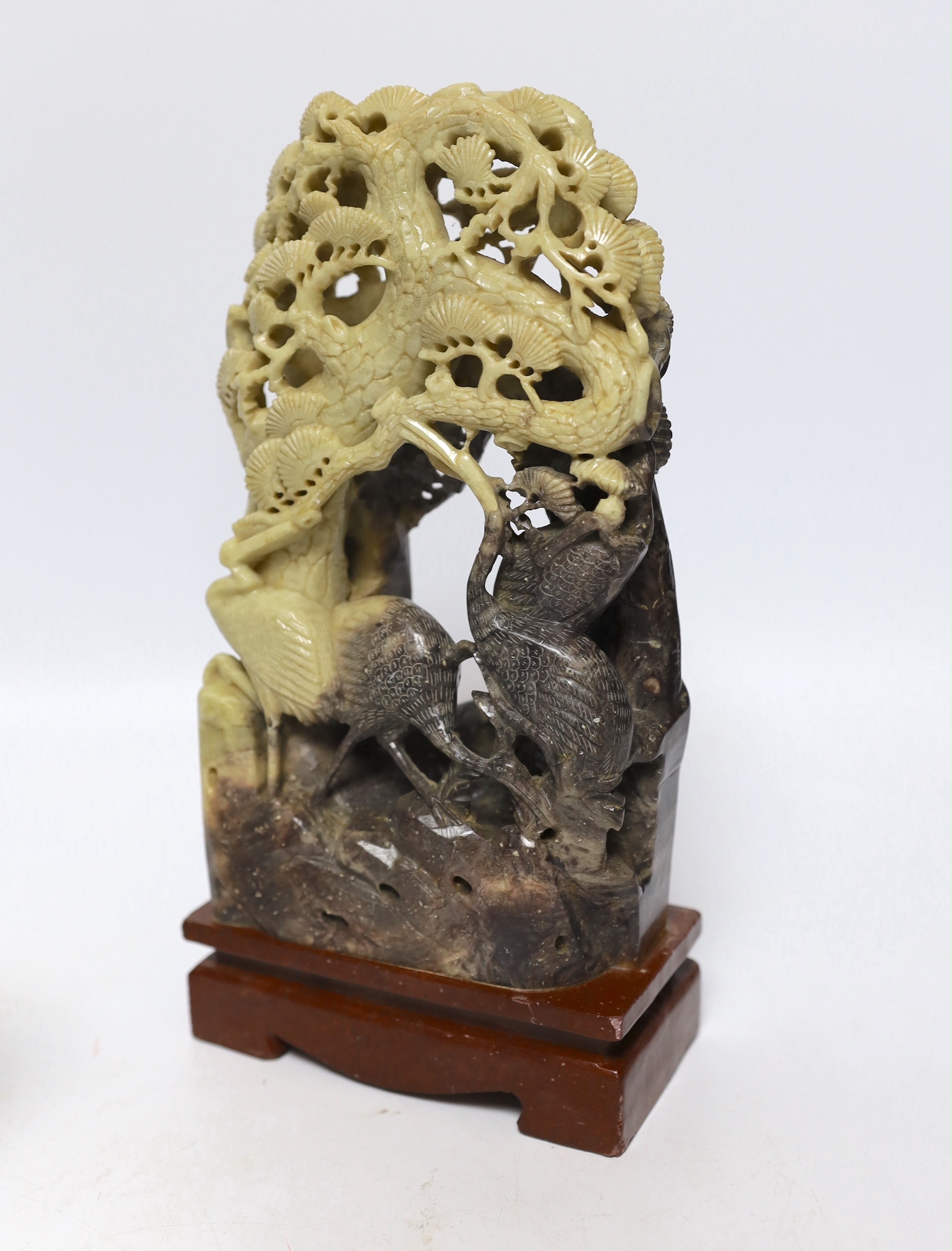Two Chinese soapstone carvings and a pewter tea canister decorated with birds, largest 24cm high